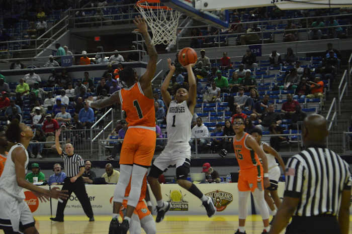 Peabody sophomore Rashad Mitchell (1) attempts a fadeaway
